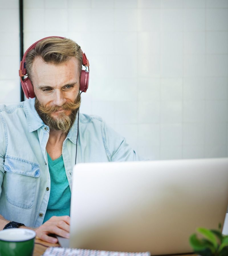 Career man laptop music streaming relaxation technology c pnbq7qb.jpg